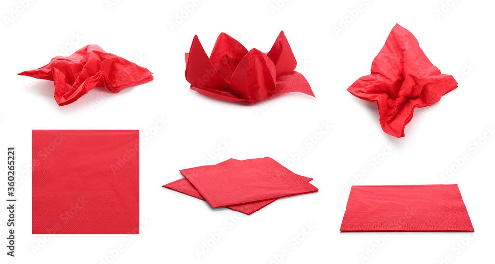 Set with red paper napkins on white background Set with red paper napkins on white background