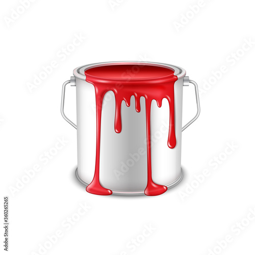 Open tin can with spilled red paint.
