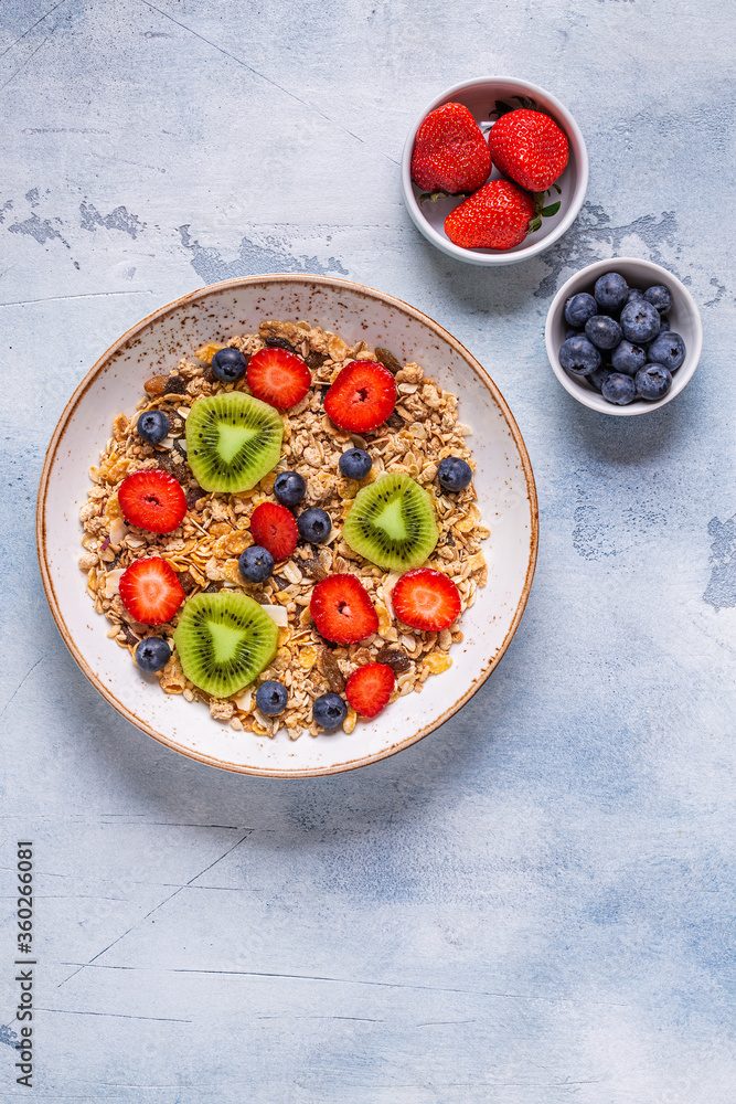 Healthy breakfast, bowl with oat granola and berries. Healthy breakfast, bowl with oat granola and berries.