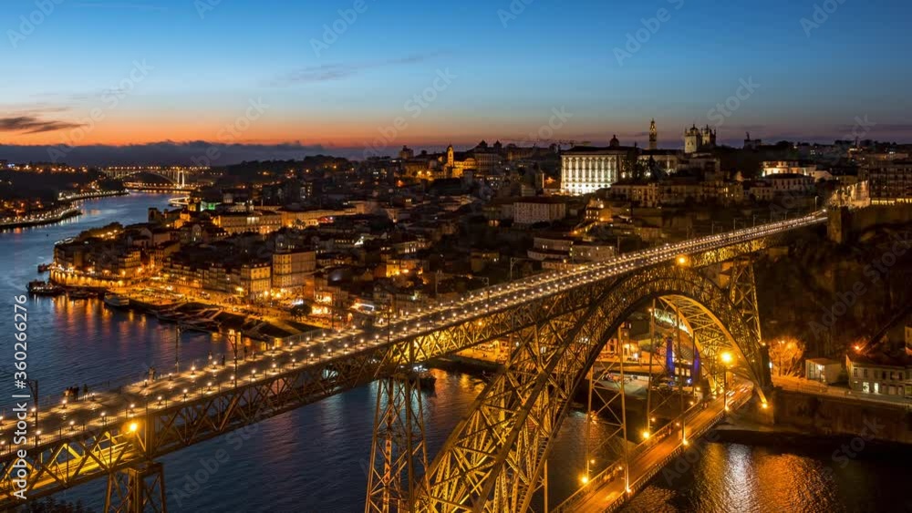Porto, Portugal, zoom out timelapse view of architectural landmark Luis I Bridge over the Douro River at dusk. Porto, Portugal, zoom out timelapse view of architectural landmark Luis I Bridge over the Douro River at dusk.