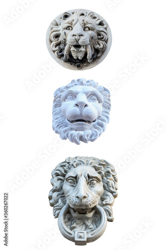 three plaster sculptures of lion heads to decorate the facade of the building isolated on a white background