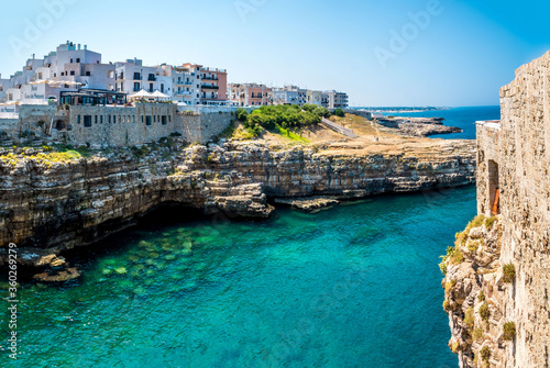 Fototapeta Naklejka Na Ścianę i Meble -  The rocky coastline at Polignano a Mare, Puglia, Italy stretches along the Adriatic sea