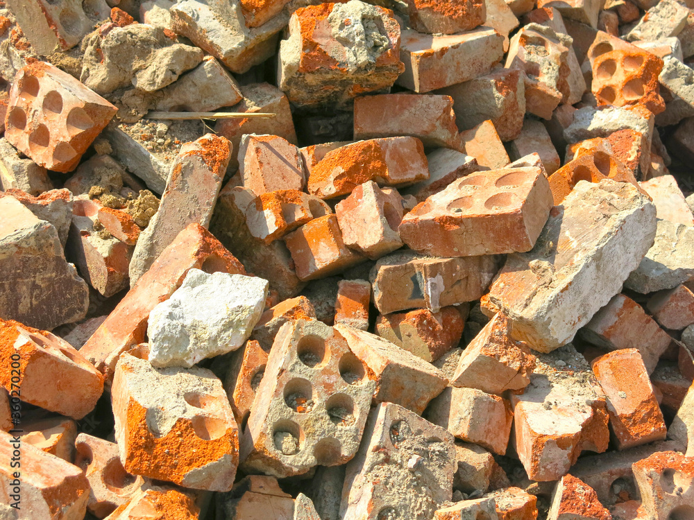 broken bricks lie in a pile in a construction waste dump broken bricks lie in a pile in a construction waste dump