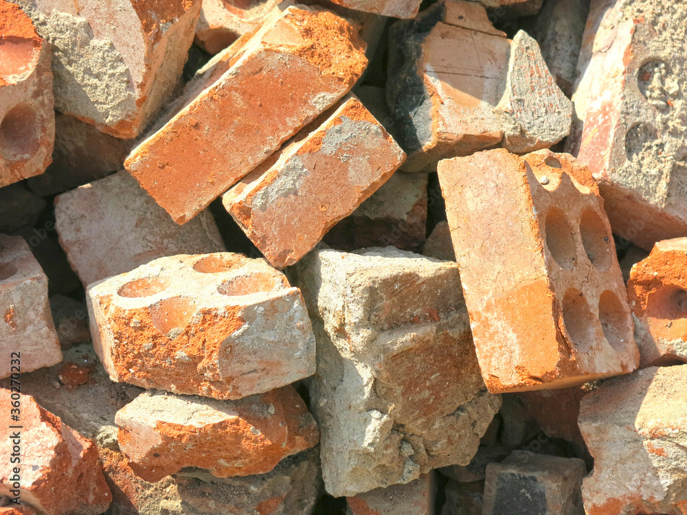 broken bricks lie in a pile in a construction waste dump broken bricks lie in a pile in a construction waste dump