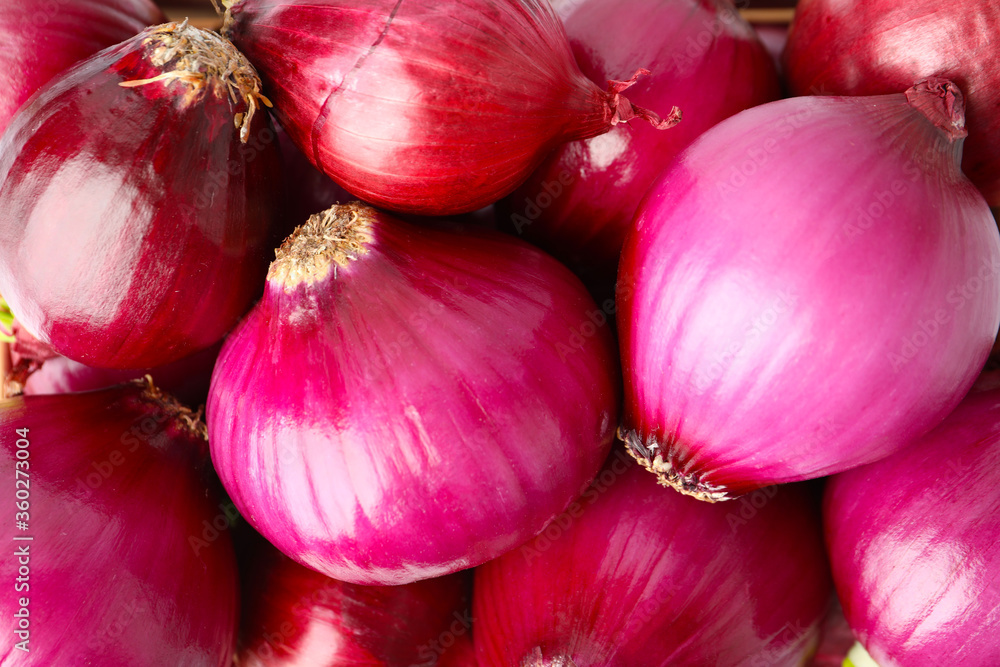 Many fresh red onions as background, closeup view Many fresh red onions as background, closeup view