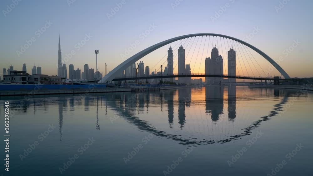 Beautiful Reflections Of Dubai Skyline By The Edge Of The Canal - wide shot Beautiful Reflections Of Dubai Skyline By The Edge Of The Canal - wide shot