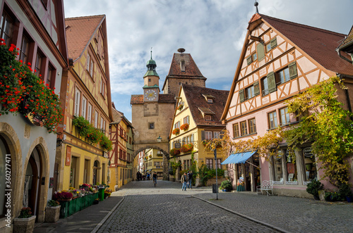 ROTHENBURG OB DER TAUBER  GERMANY - OCTOBER 18  2016  The Markus Tower  Markusturm  and old buildings on the Rodergasse street.