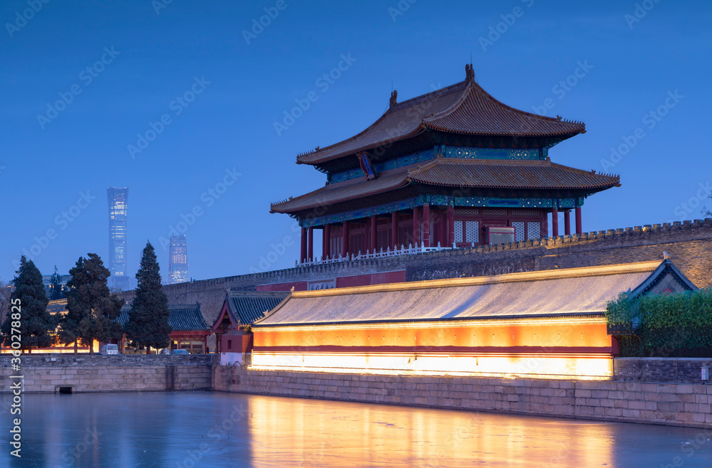 North Gate and moat of Forbidden City at dusk with CITIC Tower in background, Beijing, China North Gate and moat of Forbidden City at dusk with CITIC Tower in background, Beijing, China