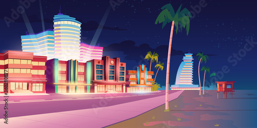 Street in Miami with hotels, sand beach and palm trees at night. Vector cartoon tropical landscape with illuminated buildings in resort city. Summer night cityscape with empty road and sea shore