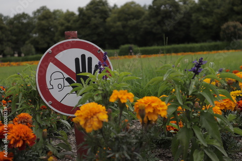 do not touch the flowers sign