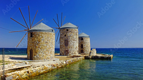 Old windmills at greek island of Chios photo