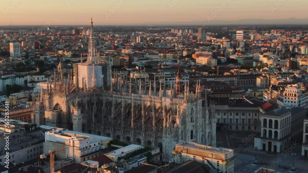milan cathedral duomo aerial view drone at sunrise,shot of city center at dawn
