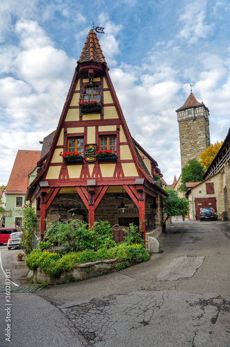 ROTHENBURG OB DER TAUBER, GERMANY - OCTOBER 18, 2016: Old Forge (Gerlachschmiede) in the centre and Roder Tower (Roderturm) on the right