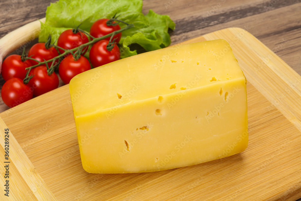 Hard yellow tasty cheese brick Hard yellow tasty cheese brick