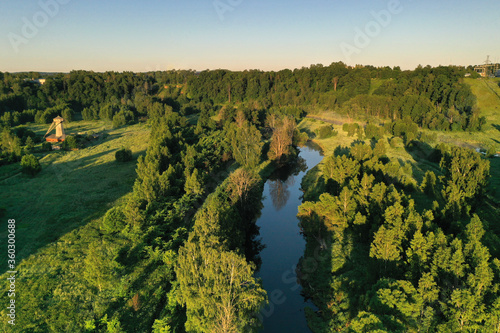 Wallpaper Mural panoramic view of green meadows in the morning haze at sunrise shot from a drone at dawn Torontodigital.ca
