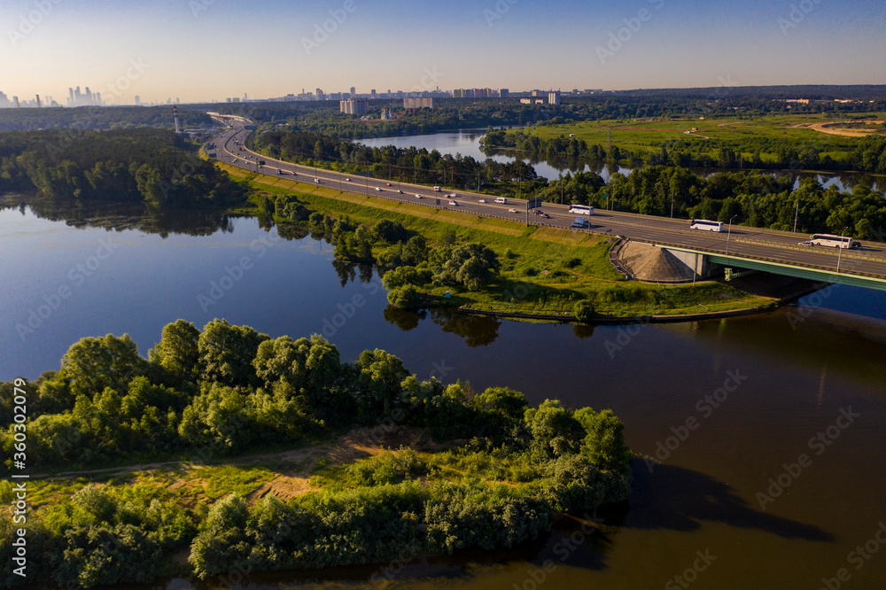 panoramic view of expressway across the river taken from a drone at dawn panoramic view of expressway across the river taken from a drone at dawn