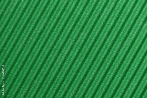 Light green colored corrugated cardboard texture useful as a background