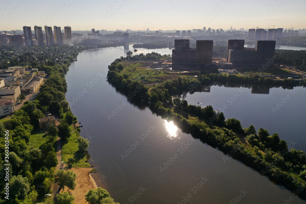 panoramic view of expressway across the river taken from a drone at dawn