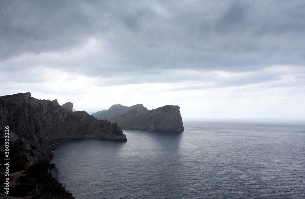 Amazing view of the sea and the cliffs before a thunderstorm. Mallorca, Balearic island, Spain. Amazing view of the sea and the cliffs before a thunderstorm. Mallorca, Balearic island, Spain.