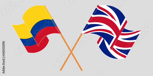Crossed and waving flags of Colombia and the UK
