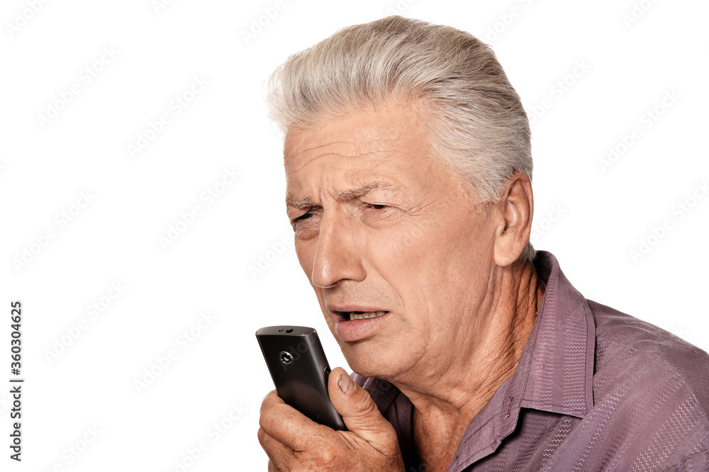 Portrait of senior man with phone on white Portrait of senior man with phone on white