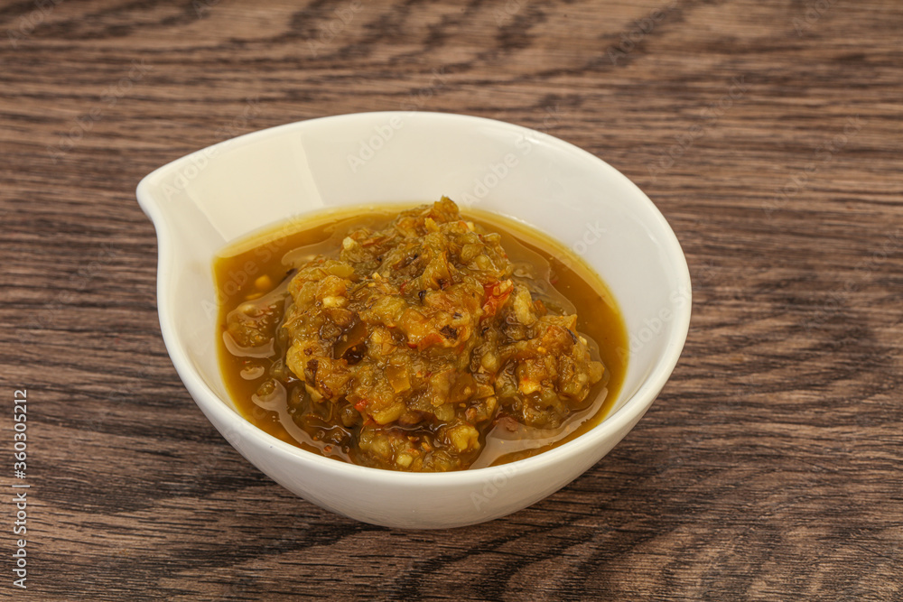 Green spicy sauce in the bowl Green spicy sauce in the bowl