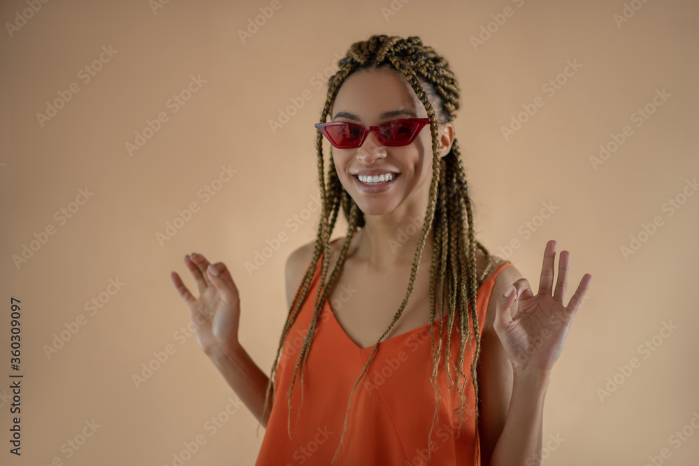 Smiling young African American showing ok with both hands Smiling young African American showing ok with both hands