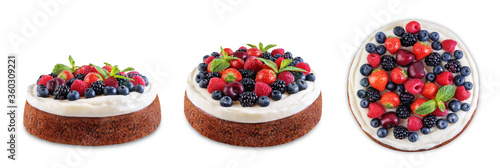 Cake with cream cheese frosting, mint leaves and berries jn a white isolated background