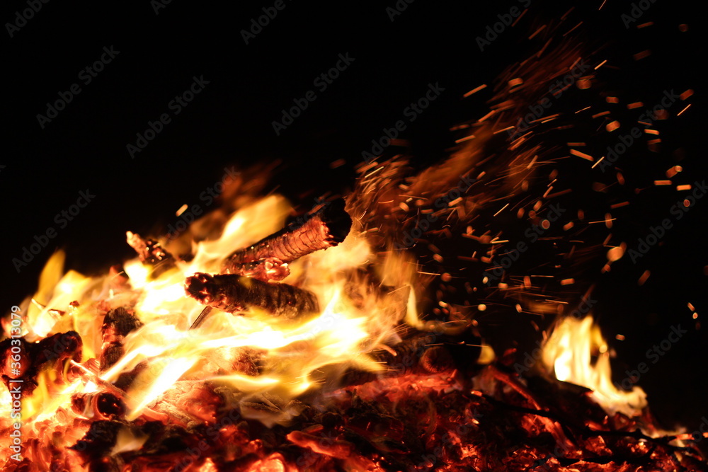 Fire. A flame on a black background. A background for designers. Colors of hell. Abstract fiery texture. Fire. A flame on a black background. A background for designers. Colors of hell. Abstract fiery texture.