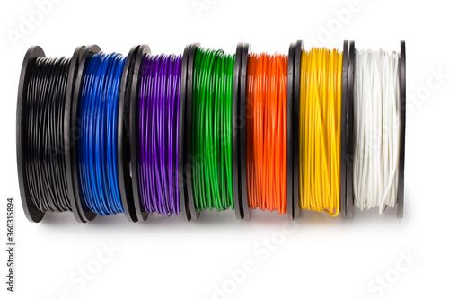 Black, red, blue, green, violet, orange, yellow, white filament 3d printer isolated on white background