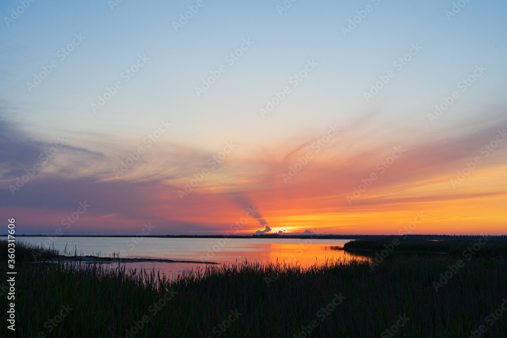 sunset over the river. Amazing colorful sundown over the lake sunset over the river. Amazing colorful sundown over the lake