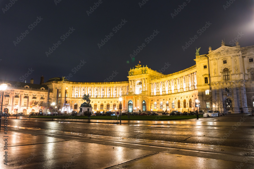 Night in the centre of Vienna in the rainy weather Austria, in Heldenplatz square, imperial palace Hofburg.