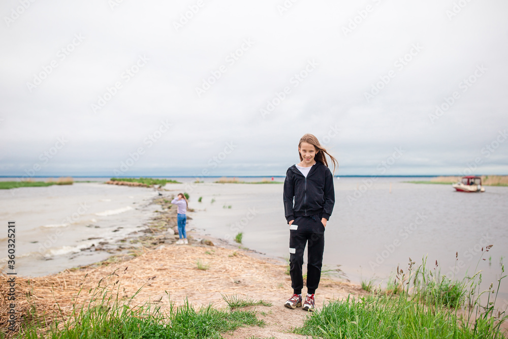 Young beautiful girl having fun on tropical seashore. Young beautiful girl having fun on tropical seashore.