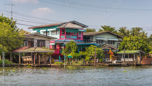 Houses on the Chao Phraya Riverside at Sunny Day in Bangkok, Thailand