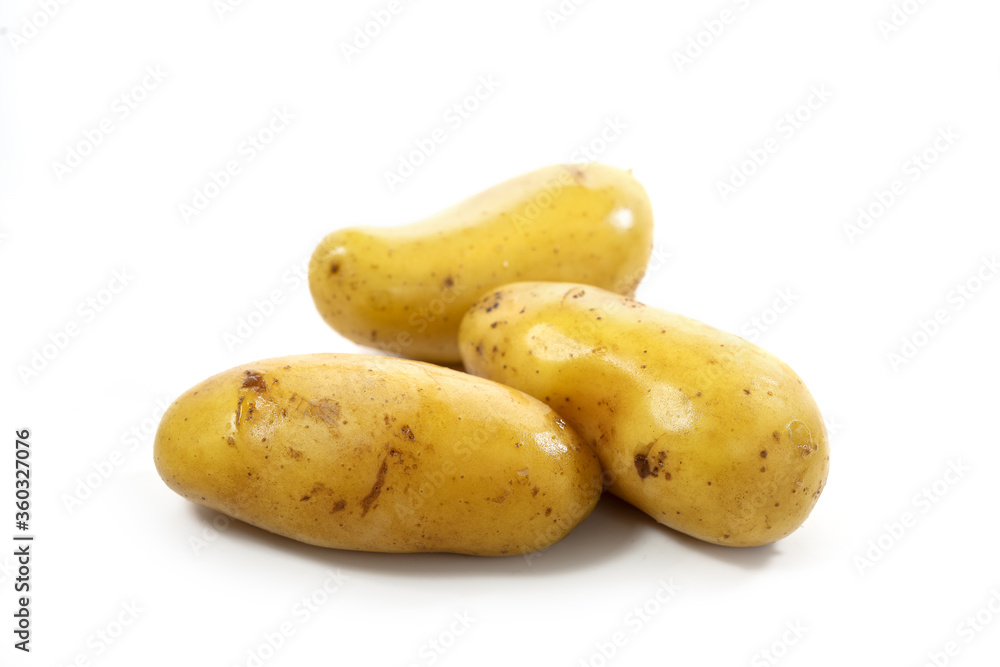 Young potatoes boiled in their skins isolated on a white background, copy space, selected focus, narrow depth of field