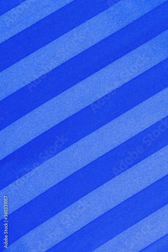 Blue diagonal stripped satin. Texture of a satin fabric as a background 
