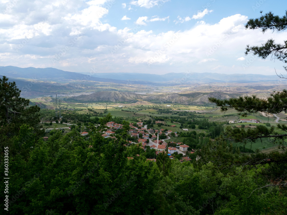 clouds and sky. beautiful view from the valley. Small towns and villages below clouds and sky. beautiful view from the valley. Small towns and villages below