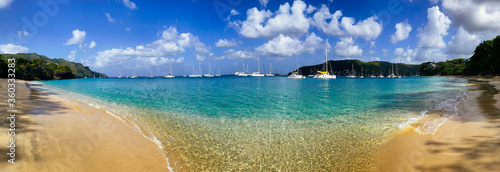 Panorama of sailboats on the turquoise water of the Caribbean sea off the coast of Bequia island