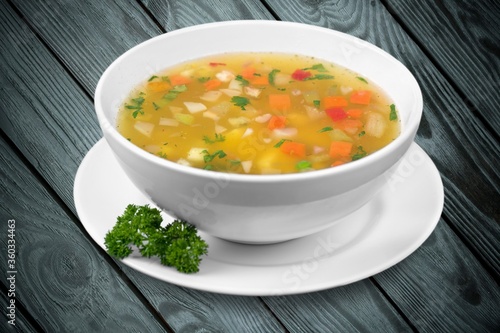 Bowl of delicious vegetable soup on a table