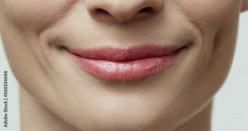 Fototapeta premium Close up of beauty woman lips, nude colors. Sexy lips