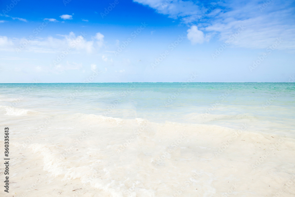 Clean white sand beach with turquoise water . Tropical island background.  Relaxing on empty beach. 