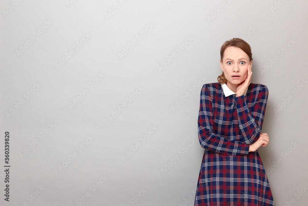Portrait of sad unhappy shocked girl with widened eyes and open mouth Portrait of sad unhappy shocked girl with widened eyes and open mouth