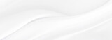White gray satin texture that is white silver fabric silk panorama background with beautiful soft blur pattern natural.