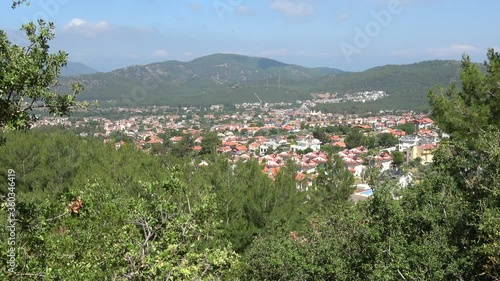 Ovacik, Fethiye, Turkey - 11th of Jane 2020: 4K Beautiful panorama on the Ovacik village sinking in the Lycian forest
 photo