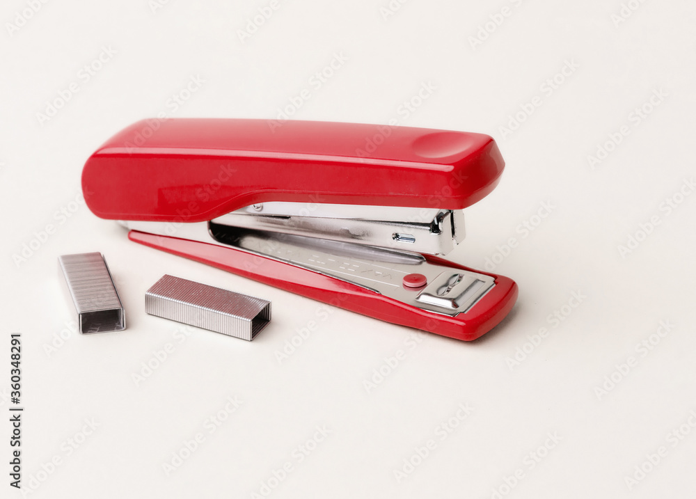 Red stapler on a white background. Red stapler on a white background.