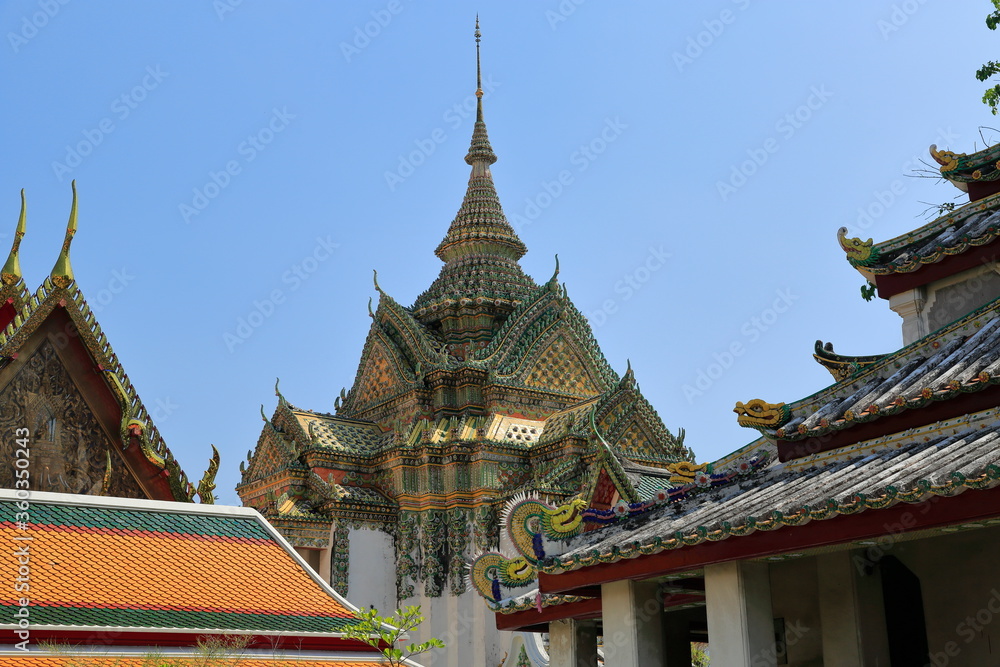 Wat Pho Buddhist Temple. Bangkok, Thailand. Every detail in the temple area, decorated with extraordinary decorations, is appreciated by all visitors.