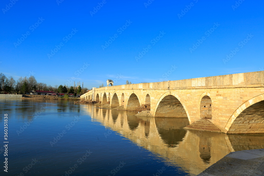 Meric bridge, Turkey.In Edirne on the border with Greece, the river Meric and its bridge, and the Selimiye Mosque in the background.