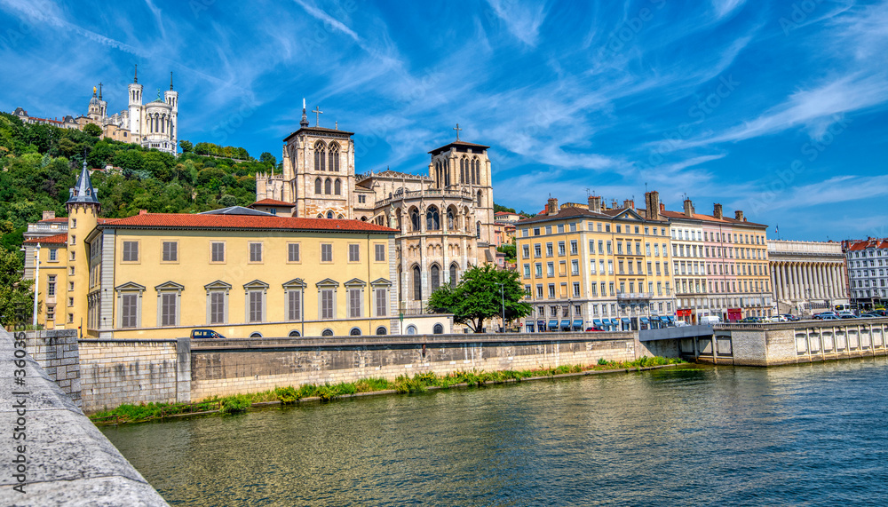 A pic taken from a bridge in Lyon France of the buildings along the river Rhone