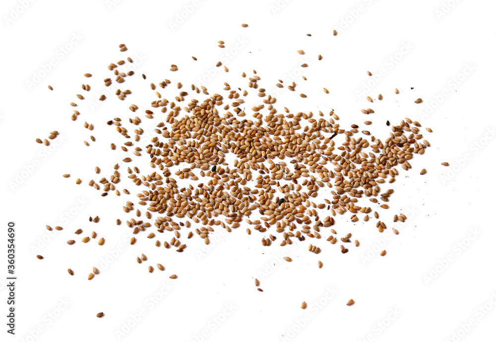 Heap of organic natural sesame seeds over isolated on white background Heap of organic natural sesame seeds over isolated on white background