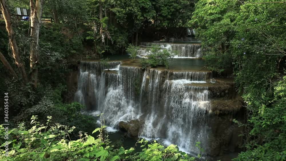 beautiful deep forest waterfall pour downward rapidly to each step, Huay Mae Kamin waterfall in Thailand beautiful deep forest waterfall pour downward rapidly to each step, Huay Mae Kamin waterfall in Thailand